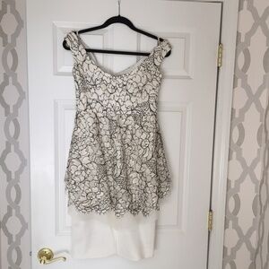 Lela Rose designer white event dress with black lace overlay.